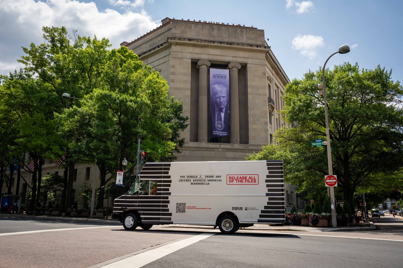 The Trump and Epstein Memorial Bookmobile parked outside the U.S. Department of Justice in Washington, D.C.